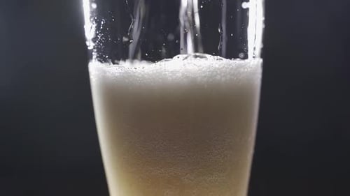 Beer is Being Poured into a Glass