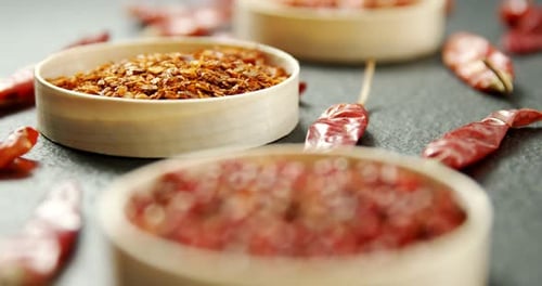 Assorted Red Spices in Wooden Bowls Close Up