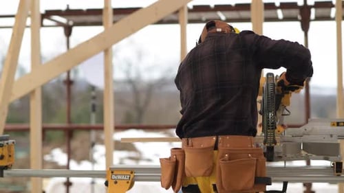 Worker in His 40s and Circular Saw Cutting Job