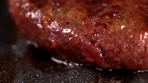Process of Roasting Meat Steak on Barbecue Grill Plate