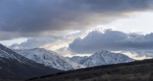 Timelapse of Epic Clouds at Mountain Medow at Autumn Time. Wild Endless Nature with Snow Storm Sky