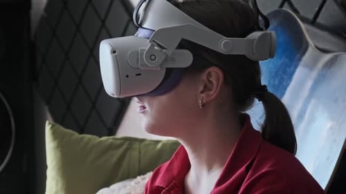 Woman Using Virtual Reality Headset in Room