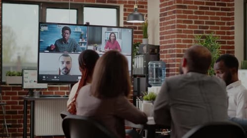 Business People on Hybrid Video Conference Call