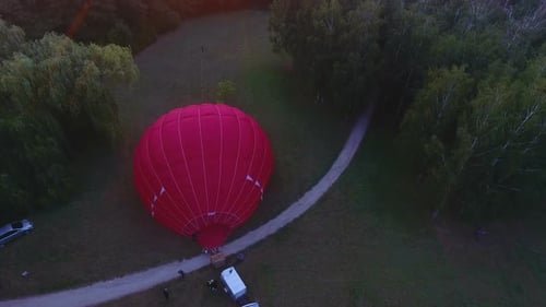 Hot Air Balloon in City Park at Sunrise