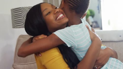 Loving Mother and Child Embracing Affectionately Indoors