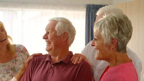 Happy Senior Friends Together Indoors at Home