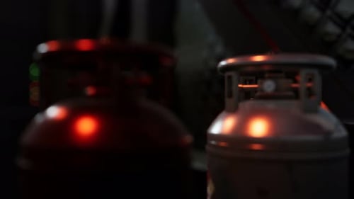 Atmospheric 3D Render of Industrial Gas Cylinders in Dark Setting