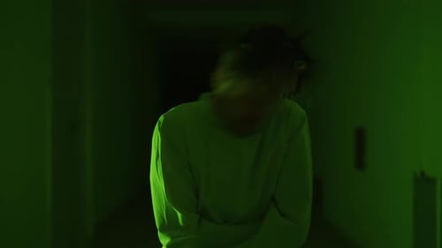 A Mad Male Patient in Straitjacket is Going Crazy in a Mental Hospital