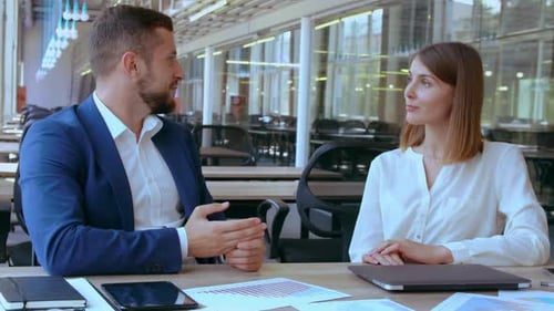 Business Meeting: Man and Woman Discussing Strategy in Office