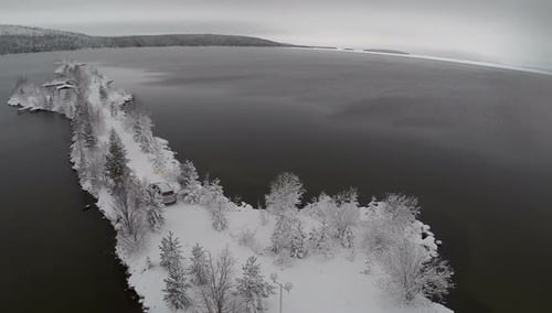 Aerial View of Car Parked on Snowy Peninsula