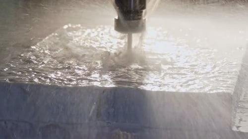 CNC mill manufacturing an advanced metal part with liquid cooling