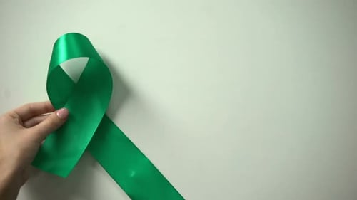 World Mental Health Day Inscription, Green Ribbon on Table, Awareness Campaign