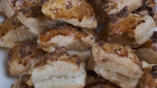 Golden Brown Pastries Piled on a Plate