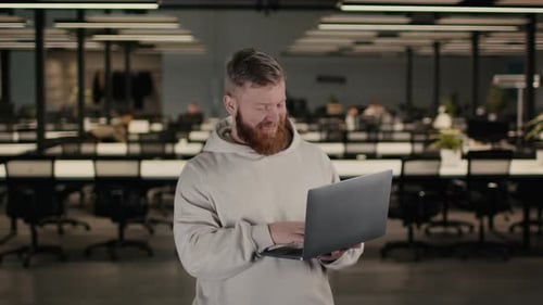 Businessman Using Laptop Typing Working Online Standing In Coworking Office