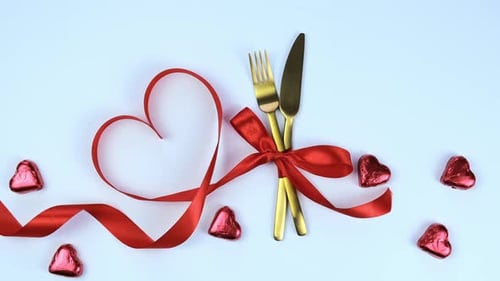 Heart Shaped Ribbon and Golden Cutlery
