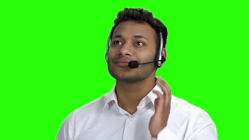 Smiling Darkskinned Man with Headset on Green Screen