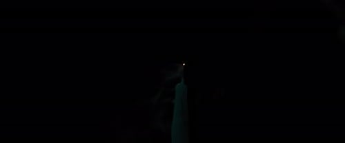 Single Candle Flame Extinguished in the Dark