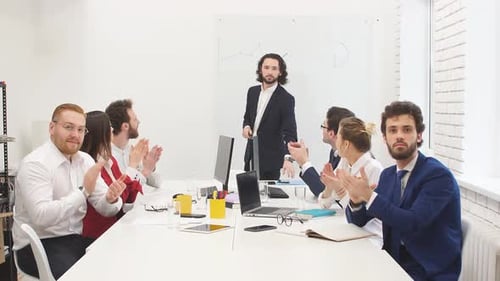 Happy Boss an Workers in Office