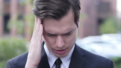 Frustration, Tension, Stress Gesture by Businessman with Headache