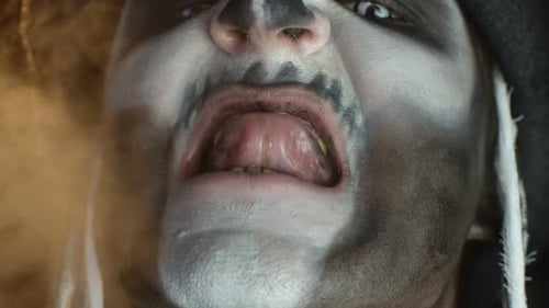 Menacing Man with Skull Makeup Close Up