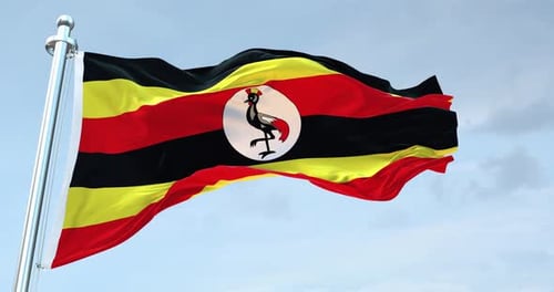 Realistic Waving Flag of Uganda on a Bright Sky