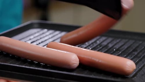 Meat Sausages Are Fried On Grill