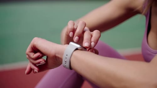 Woman Using Smart Watch After Fitness Workout
