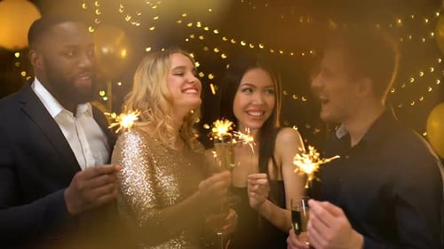 Friends Celebrating with Sparklers and Champagne