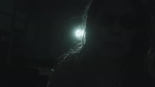 Zombie Woman Stares in the Dark
