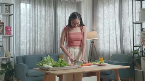 Woman Preparing Fresh Vegetables in Home Kitchen