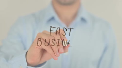 Writing Fast Business on Clear Surface with Marker