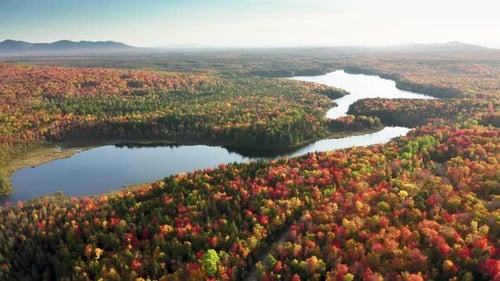 Aerial Footage of Mountainous Landscape Washed with Bluish Waters of the River