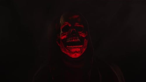 Scary Skeleton skull head figure in a hood for Halloween or horror videos