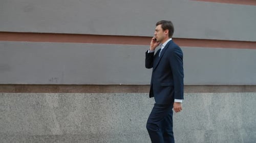 Side View Businessman Talking Phone at Street. Man Talking Phone with Partner