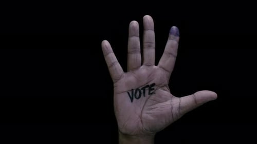 Hand with Vote Written on Palm on Black