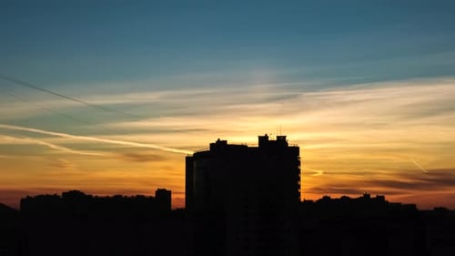 Silhouette of City Buildings Against the Backdrop of the Sunset Sky