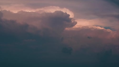Tranquil Movement of Clouds during Sunrise