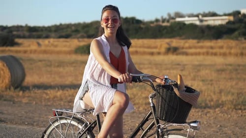 Cheerful Smiling Caucasian Young Woman Waving Looking at Camera Posing at Background of Yellow
