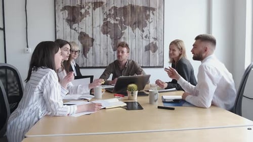 Group of Young People Are Discussing Something in a Modern Office