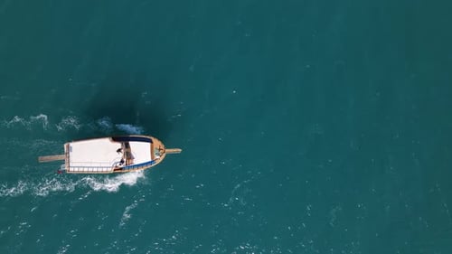 Beautiful Boat Sailing Across Turquoise Ocean Waters