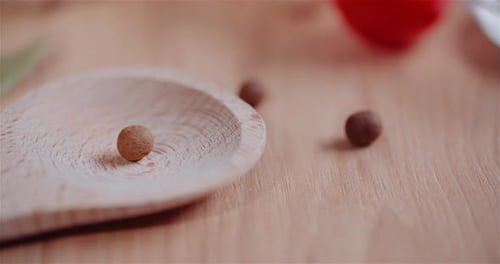 Close Up of Spice Balls on Wooden Spoon