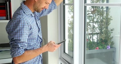 Man using mobile phone at home 4k