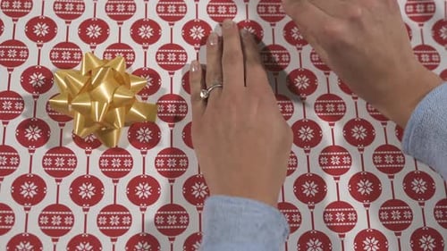 Ripping a Christmas wrapping paper
