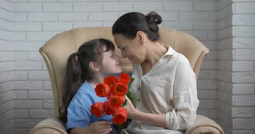 Child Giving Flowers to Mother, Sweet Moment