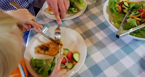 Family having meal together in restaurant 4k