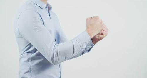 Person Cracking Knuckles on White Background