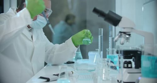 Scientist Working in a Clean Lab with Equipment