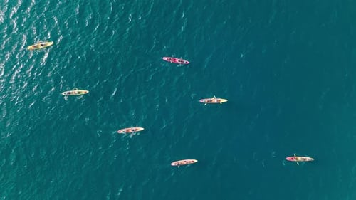 Aerial Drone Video of Women and Men Tourists Rowing in Sports Kayak on Hawaii