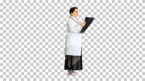 Senior female radiologist examining brain scan mri, Alpha Channel