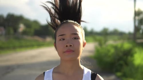 Young beautiful asian woman Jogging in the park